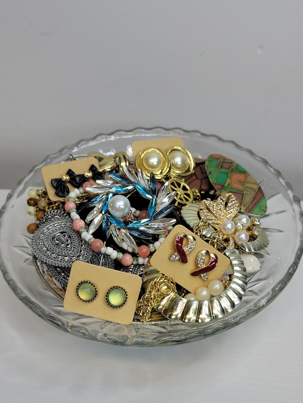 Mixed Jewelry In A Glass Dish